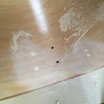 Shaving off the dowels, then sanding smooth.