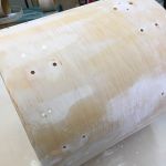 Sanding and cleaning up and rough spots and old glue.