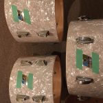 Putting the badges back on, rivets and glue.