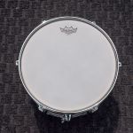 Remo Ambassador Coated on all the batter sides.