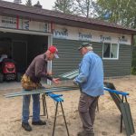 Dad and friend helping with the siding