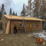 Roof sheathing happening, dad is burning scrap and the fire is nice